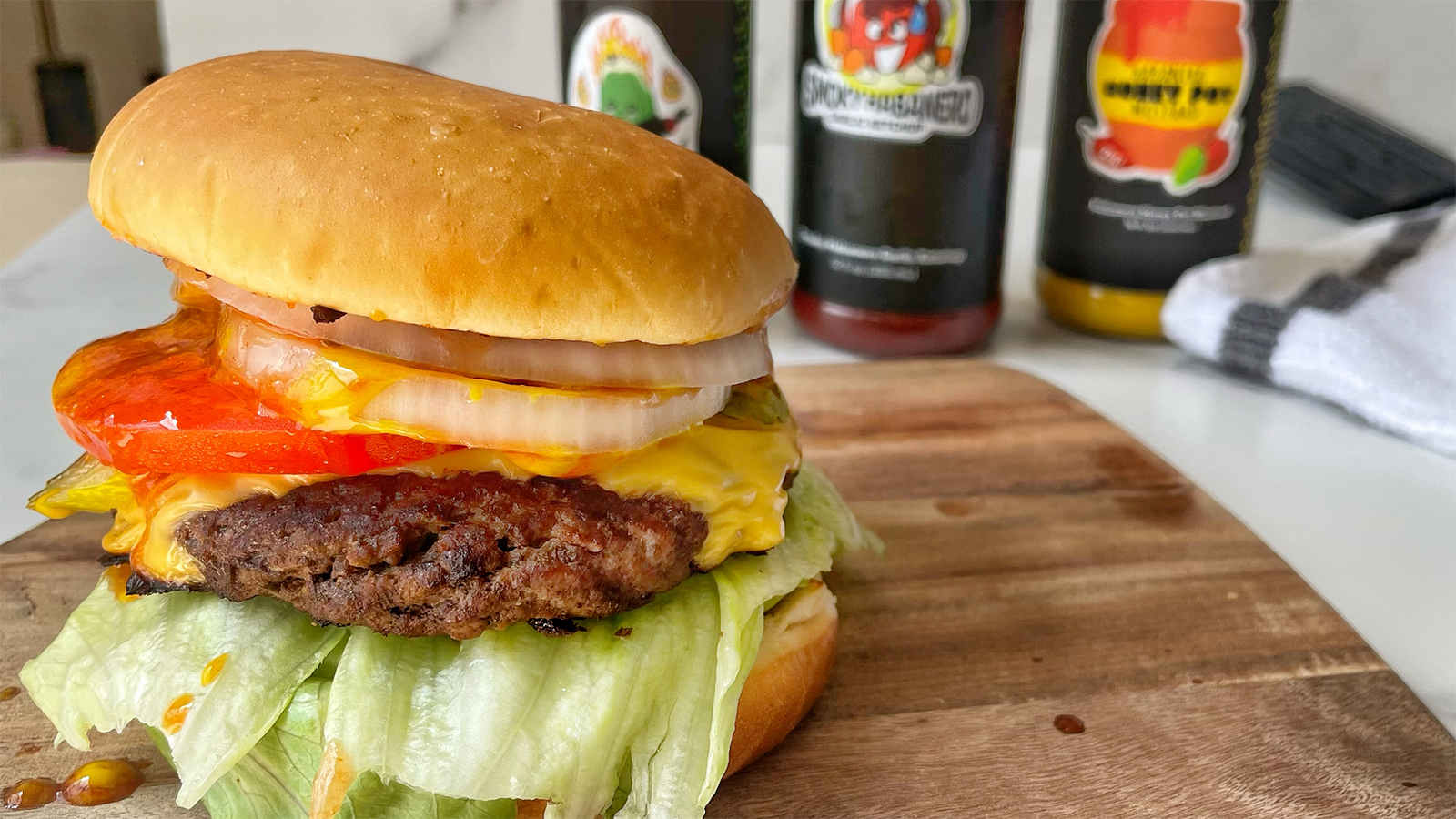 Sauce'd Smashburger with Smoky Habanero Garlic Ketchup, Habanero Honey Pot Mustard, and Fiery Dill Pickle Hot Sauce