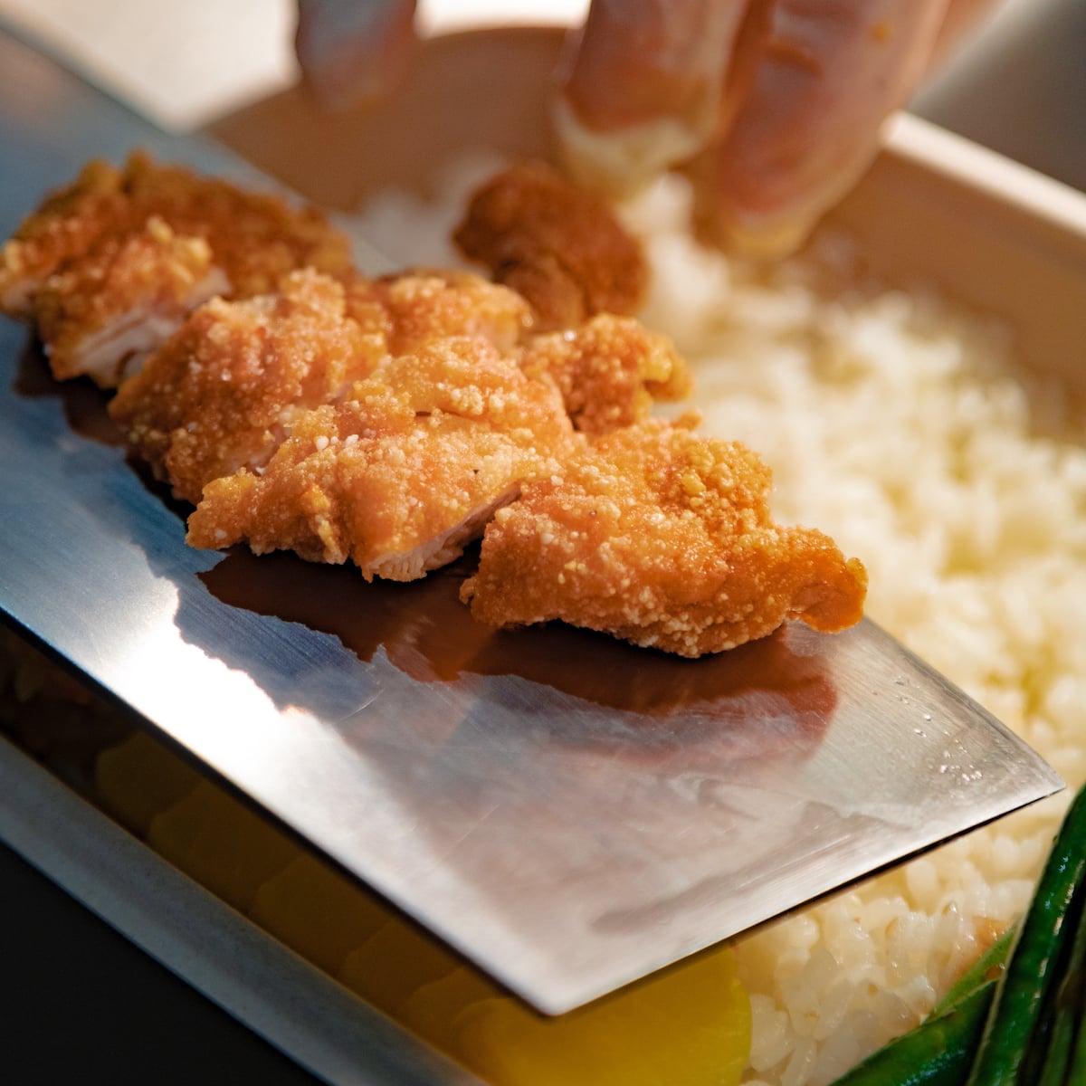 Plating a crispy fried pork chop